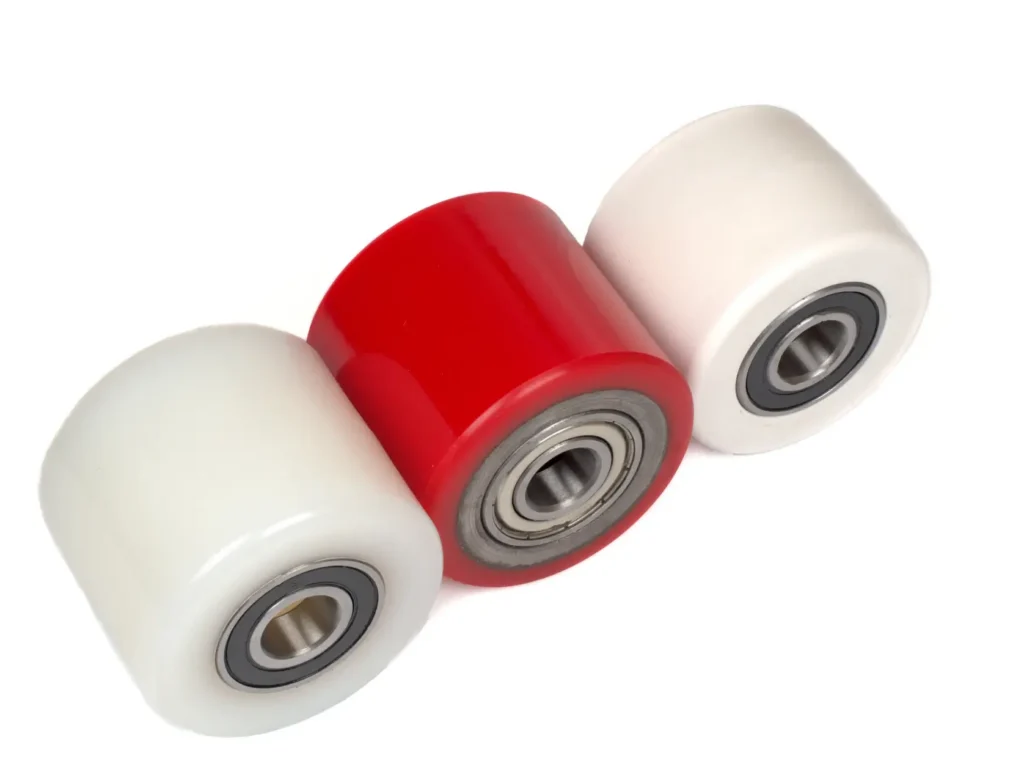 Two white and one red custom urethane rollers.